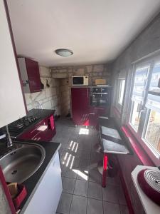 a small kitchen with a sink and a stove at maison de loire in Villebernier +58 photos