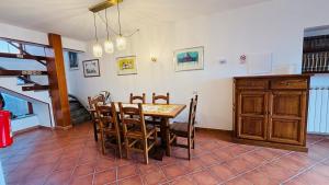 a kitchen and dining room with a table and chairs at A casa nostra in Formello