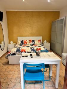 a bedroom with a bed and a table and chairs at Dei Meravigli in Bari +51 photos