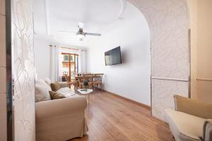 a living room with a couch and a table at Can Calco old town in Alcudia