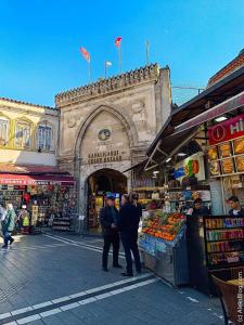 a group of people standing in front of a market at Retro Boutique in Istanbul