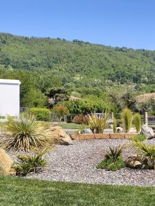 a giraffe laying on the ground in a garden at B&B La Barbatella in Palazzo Canavese