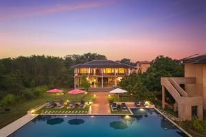 an aerial view of a villa with a swimming pool at Ceylon Breeze Sigiriya in Sigiriya