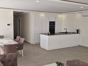 a kitchen with a sink and a counter top at Villa Maja in Sutomore