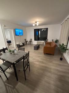a living room with a table and a couch at Lafayette in Elizabeth