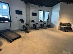 a gym with several treadmills and exercise bikes at Lafayette in Elizabeth