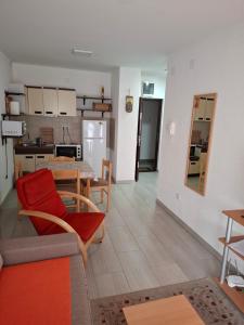 a living room and kitchen with a table and a couch at Visnja in Gornja Toplica