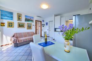 a living room with a table and a couch at Bella Vista in Varenna