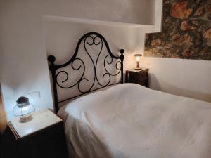 a bedroom with a bed with a white bedspread at Pilarella Gallery trilocale vistamare in Porto Santo Stefano