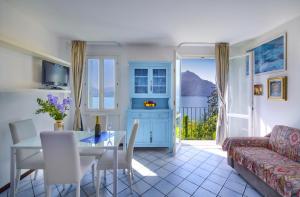 a living room with a table and a couch at Bella Vista in Varenna