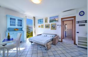 a bedroom with a bed and a table and a desk at Bella Vista in Varenna
