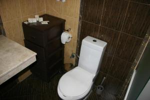 a bathroom with a white toilet and a sink at Alexander 3327 in Bansko +36 photos