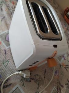 a toaster sitting on top of a table at Cozy Studio East-Side in Cluj-Napoca