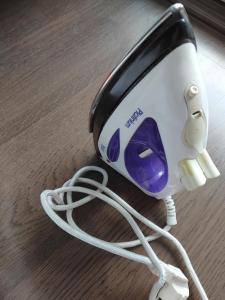 a toaster with a cord plugged into it on a table at Cozy Studio East-Side in Cluj-Napoca