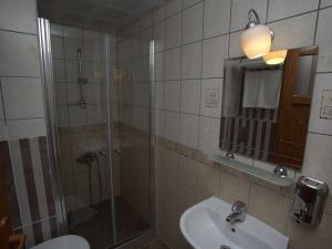 a bathroom with a shower and a toilet and a sink at Oscar Boutique Hotel in Antalya +31 photos