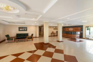 a living room with a checkered floor at Hotel Imphal by the Classic in Imphal