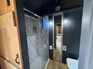 a bathroom with a shower and a tub at Lake View Retreats in Rickmansworth +55 photos