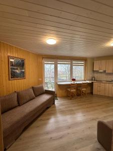a living room with a couch and a table at Pas Aldoną in Šventoji
