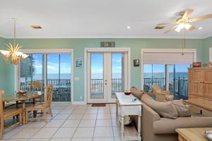 a living room with a couch and a table at Beach Blessing by Pristine Property Vacation Rentals in Cape San Blas