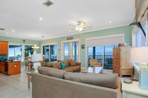 a living room with a couch and a table at Beach Blessing by Pristine Property Vacation Rentals in Cape San Blas