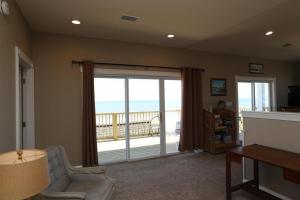 a living room with a view of the ocean at Buckleys Beach House by Pristine Property Vacation Rentals in Indian Pass