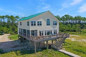 an aerial view of a house with a deck at Hatchling Hideaway by Pristine Property Vacation Rentals in Indian Pass