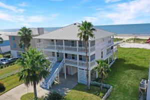 an aerial view of a house with palm trees at White Pelican by Pristine Property Vacation Rentals in Indian Pass