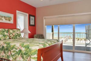 a bedroom with a bed and a view of the ocean at Villa del Sol by Pristine Property Vacation Rentals in Cape San Blas +60 photos