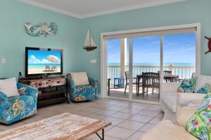 a living room with a view of the ocean at Villa del Sol by Pristine Property Vacation Rentals in Cape San Blas