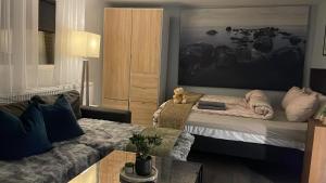 a living room with a bed and a couch at Boutique apartment in Strömstad in Strömstad