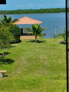 a house on the shore of a lake at Lazer , Descanso, Pesca e Praia in Iguape +20 photos