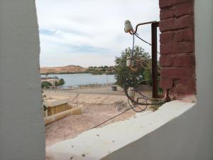 a view of the water from a building with a street light at sunset in Abu Simbel +27 photos