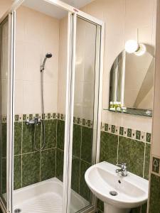a bathroom with a shower and a sink at Willa Park in Zakopane +16 photos