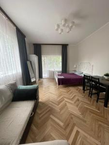a living room with a couch and a table at K14 Stay 1 in Riga