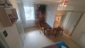 an overhead view of a room with a table and a kitchen at appartement 4 places centre-ville in Cauterets