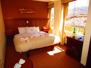 Letto o letti in una camera di Hotel Waynapicchu