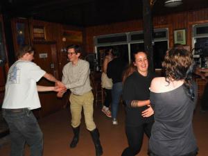 a group of people dancing at a party at Loch Ness Lochside Hostel - Over 16s Only in Invermoriston