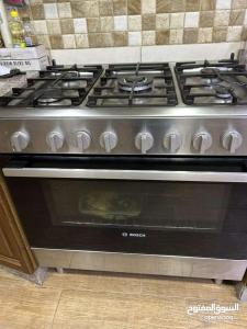 a stove top oven sitting in a kitchen at Jordan Amman in Amman