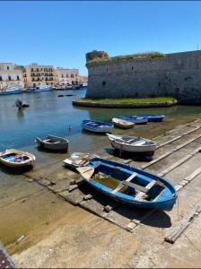 a group of boats sitting on a dock in the water at Supera Home in Gallipoli