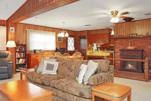 a living room with a couch and a kitchen at Wales Pod by Pristine Properties Vacation Rentals in Indian Pass