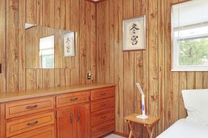 a bedroom with a dresser and a mirror at Wales Pod by Pristine Properties Vacation Rentals in Indian Pass