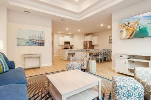 a living room with a couch and a table at WindMark Beach North by Pristine Properties Vacation Rentals in Saint Joe Beach