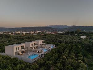 an aerial view of a house with a swimming pool at Hesperian Luxury Villas with Private Heated Pools in Chania