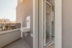 a bathroom with a sink and a window at Palladio13 in San Benedetto del Tronto +229 photos