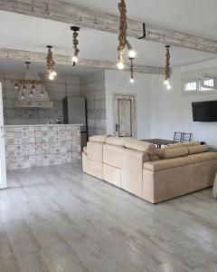 a large living room with a couch and a table at La Rocina in Sanlúcar de Barrameda