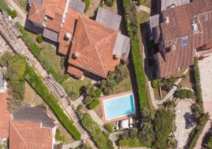 an overhead view of a house with a swimming pool at Villa Gilda - Private Pool by Host Hero in Stintino +61 photos