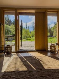 a room with a door open to a patio at Camping Ursulet Durau in Ceahlău