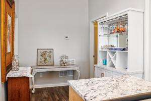 a kitchen with a counter and a counter top at Quarters B by Pristine Properties in Mexico Beach +57 photos