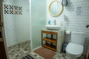 a bathroom with a sink and a toilet at Moondock Luxury Camp in Munduk +76 photos
