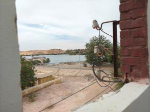 a camera on a building with a view of a lake at sunset in Abu Simbel